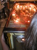 Alyssa playing the pinball game from front left.