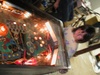 Alyssa playing the pinball game - side shot.