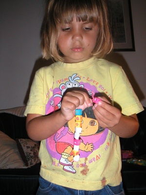 Emily's necklace is made of many different type of beads.