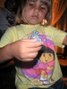 Emily pulling the string for another necklace. Emily pulling the string for another necklace.