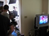 Cameraman preparing to film. Cameraman preparing to film.