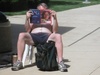 Sunbathing and reading for all to see.